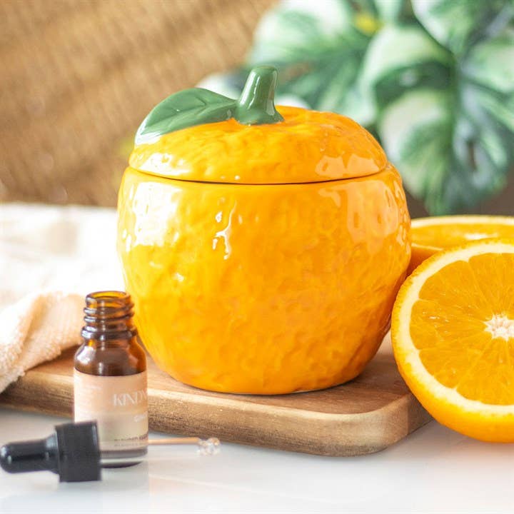 Schattige sinaasappel-waxverwarmer met deksel – perfect voor geurverspreiding en als kleurrijk woonaccessoire.